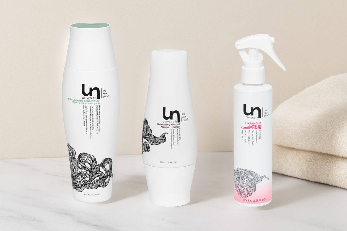 Bio-Cleansing Conditioner, Hydrating Masque, and Untangle Leave-In Conditioner in bathroom