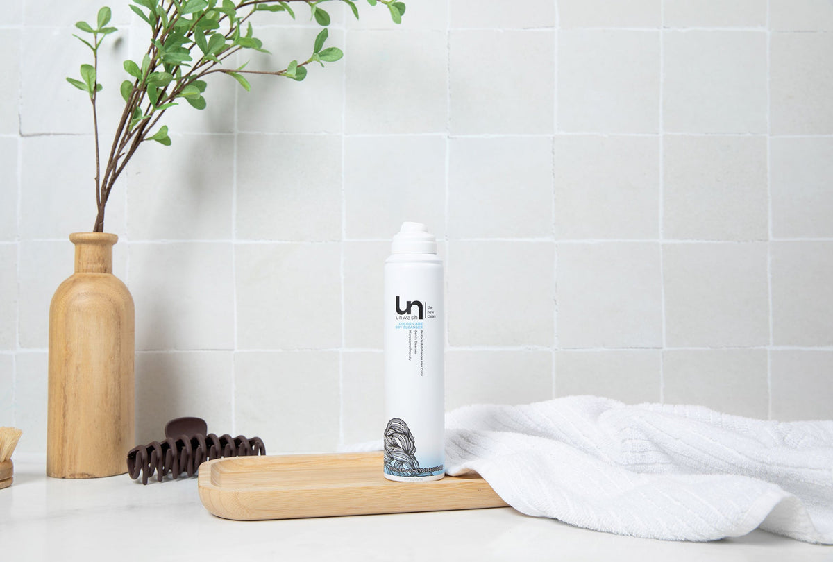 clean minimal flat lay background with soft shadows and hair care styling tools on white surface